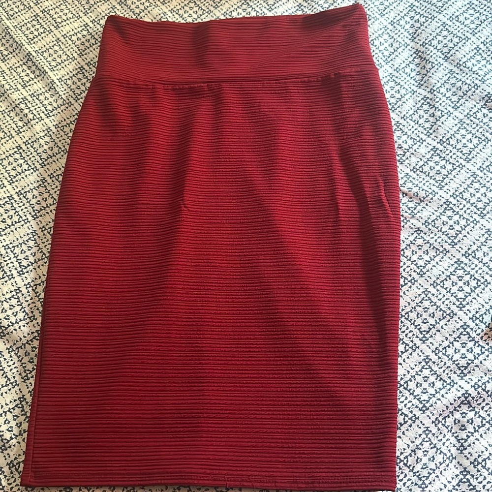 Burgundy pencil skirt can be wore with a crop top or any type of shirt.